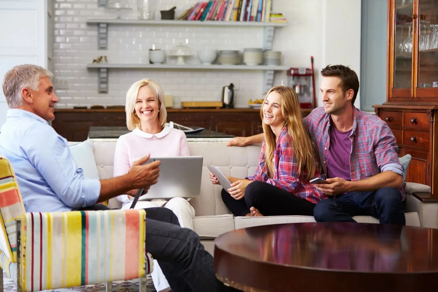 Two couples sharing a conversation at home